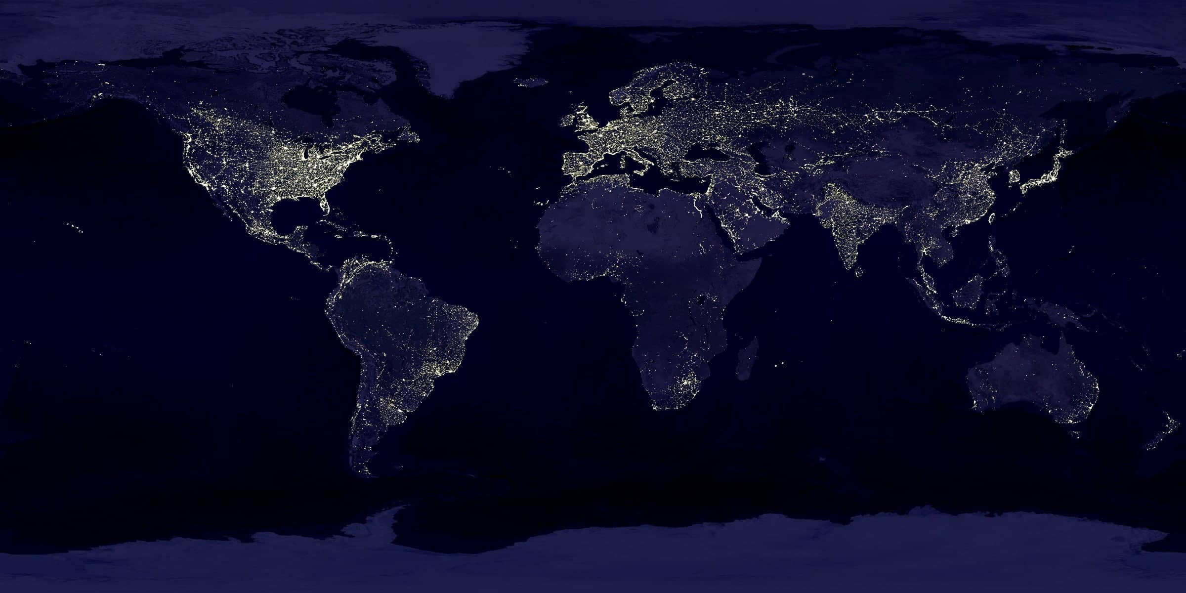 A picture of the globe at night where lights show the population centers and connectivity of the world. This article is about remote monitoring and management or RMM software which helps managed service providers or MSPs assist clients in managing IT environments.