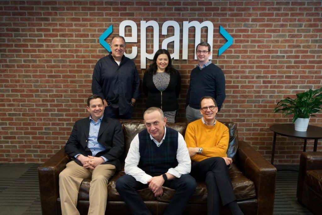 CEO Arkadiy Dobkin (sitting, center) sits EPAM Systems’ leadership in the company’s Newtown, Pennsylvania HQ in 2019.

From left to right: (sitting) Scott Nissenbaum, BFTP Chief Investment Officer; Arkadiy Dobkin, EPAM CEO & President; Jason Peterson, EPAM CFO & Treasurer; (standing) Larry Solomon, EPAM CPO; Elaina Shekhter, EPAM CMO & Head of Strategy; Jonathon Beschen, BFTP Manager, Technology Commercialization. 