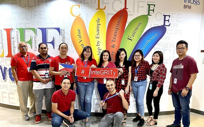 Part of the BPM Philippines team at an Infosys delivery center.