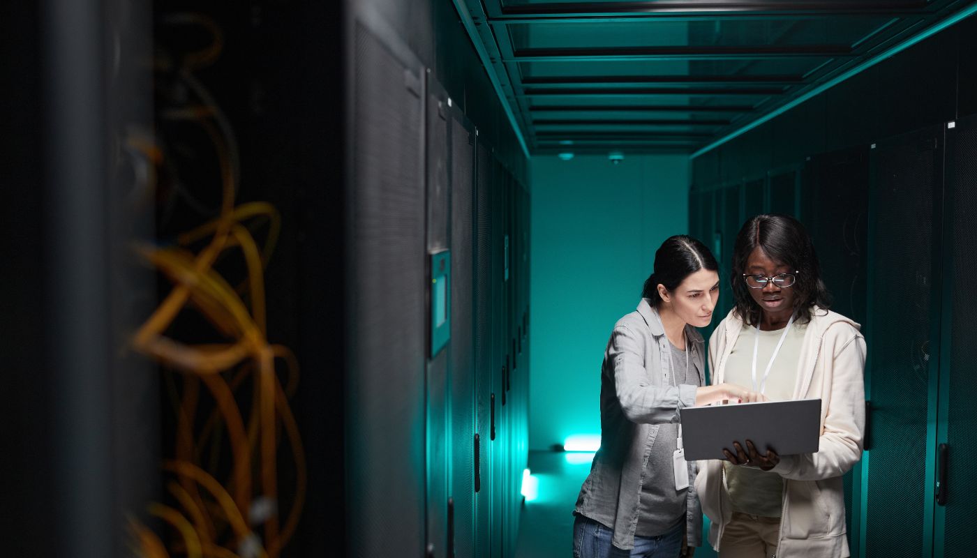 Two Women Managing Server Network